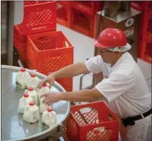  ?? JASON KOSKI (UREL) ?? Staff at work in Cornell’s new Dairy Facility in Stocking Hall.