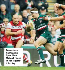  ??  ?? Tenacious: Australian flyer Nick Malouf races in for Tigers’ third try