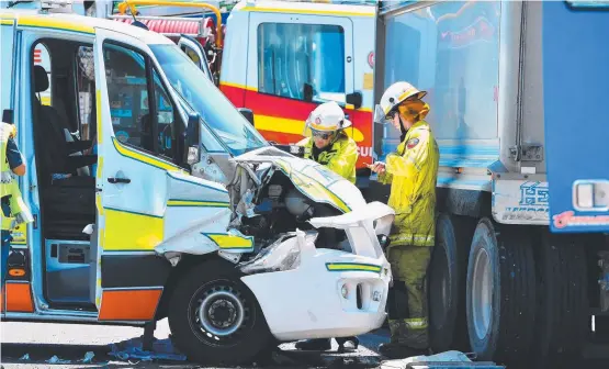  ?? COLLISION: Emergency services at the scene of an accident between a truck and an ambulance on the corner of Hugh and Woolcock streets. Pictures: ZAK SIMMONDS ??