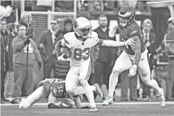  ?? ERIC HARTLINE/USA TODAY SPORTS ?? Cardinals wide receiver Greg Dortch (83) picks up yards after catch against the Eagles on Dec. 31 in Philadelph­ia.