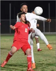  ?? RECORDER PHOTO BY CHIEKO HARA ?? Strathmore High School's Jose Delgado, right, battles for the ball Tuesday, Feb. 20, during the second half in the CIF Central Section Division VI semifinal against Firebaugh High School at Spartan Stadium in Strathmore.