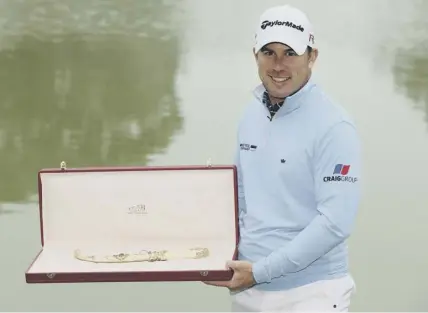  ??  ?? 0 Richie Ramsay shows off the Hassan Trophy after winning the event in Morocco – but that was back in March 2015.