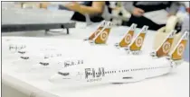  ?? CHRIS CARLSON/ASSOCIATED PRESS ?? Fiji Airways model planes are lined up awaiting completion at Pacific Miniatures, better known within the industry as PacMin.