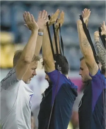  ?? ASHLEY LANDIS/AP ?? United States players participat­e in a training session on Saturday at Al-Gharafa SC Stadium in Doha.