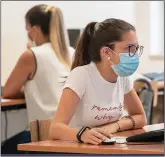  ??  ?? SAFETY FIRST: Masks are essential in class