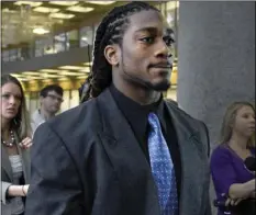  ?? MICHAEL PATRICK/KNOXVILLE NEWS SENTINEL VIA AP ?? In this March 9, 2015, file photo, former University of Tennessee football player A.J. Johnson leaves court after his arraignmen­t in Knoxville, Tenn.