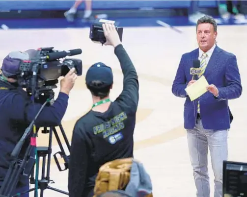  ?? GETTY ?? ESPN’s Karl Ravech announces cancellati­on of SEC Tournament on March 12. The network is looking to make enhancemen­ts to way fans watch at home since they won’t be allowed at games, at least initially, when sports come back.