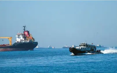  ?? KHALIL HAMRA/AP 2022 ?? A boat in Istanbul with Turkish, Russian, Ukrainian and U.N. officials heads to inspect grain shipments from Ukraine.