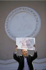  ?? LUIS SÁNCHEZ SATURNO/THE NEW MEXICAN ?? J.D. Vasquez, with the New Mexico Watchman, holds up a sign outside the state Capitol on Tuesday during a protest against legalizing cannabis.