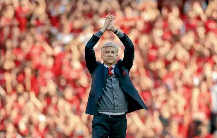  ?? AP ?? Arsenal manager Arsene Wenger applauds the fans as he takes a lap of honour at the Emriates Stadium. It was Wenger’s last home game in charge of Arsenal.