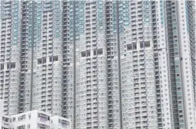  ??  ?? A residentia­l housing complex in Hong Kong. A 2016 census showed that more than 200,000 Hongkonger­s live in subdivided flats