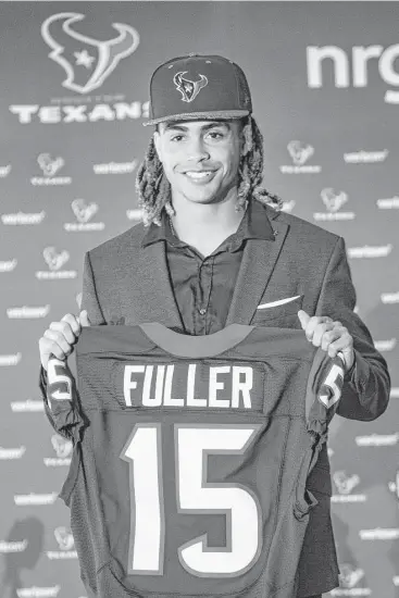  ?? Brett Coomer / Houston Chronicle ?? Notre Dame wide receiver Will Fuller shows off his new Texans jersey Friday at NRG Stadium. Fuller said being drafted No. 1 by the Texans “was the best moment of my life thus far.”