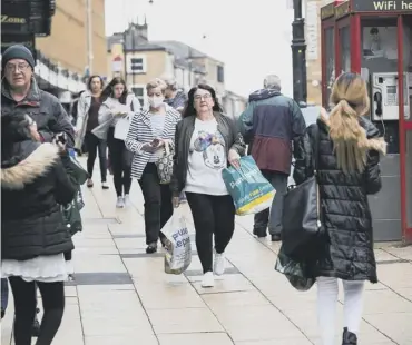  ??  ?? WARNING: A busy Market Street, Halifax, as more shops reopen as lockdown measures start to ease.