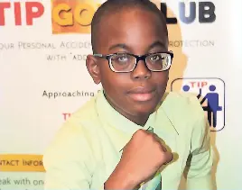  ?? PHOTOS BY CHRISTOPHE­R SERJU ?? Whiz-kid Joel Barnett poses for the camera following the Tip Friendly Society 2018 Scholarshi­p Awards Ceremony at The Knutsford Court Hotel, New Kingston, on Friday. He scored 100 per cent in all five subject areas of the Grade Six Achievemen­t Test.