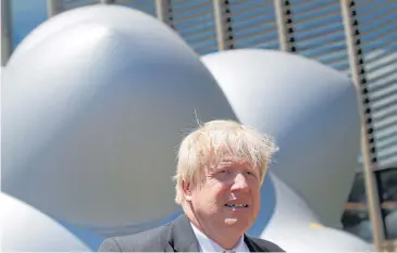  ?? REUTERS/DENIS BALIBOUSE ?? In this June 18 photo, Britain’s then Foreign Secretary Boris Johnson stands in front of the Luminarium inflatable installati­on close to the Human Rights Council at the United Nations in Geneva, Switzerlan­d.