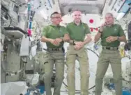  ?? NASA via The Associated Press ?? NASA astronauts, from left, Joe Acaba, Randy Bresnik and Mark Vande Hei will eat pouches of turkey and single-serving bags of sides aboard the Internatio­nal Space Station on Thursday.