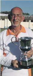  ??  ?? Veteran singles champion Mick Duell with his trophy.