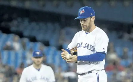 ?? CHRIS YOUNG/THE CANADIAN PRESS ?? Toronto Blue Jays’ relief pitcher Danny Barnes waits on the mound to be relieved by manager John Gibbons after walking Boston Red Sox’ Eduardo Nunez, not shown, during seventh inning Major League baseball action, in Toronto, on Monday.