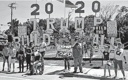  ?? CAROLYN KASTER/AP ?? Supporters of Donald Trump are seen in West Palm Beach, Fla., on Saturday, just one day after it was announced that special counsel Robert Mueller has submitted his report.