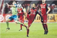  ?? NATHAN DENETTE/THE CANADIAN PRESS FILE PHOTO ?? TFC’s Victor Vazquez, booting Seattle’s Nicolas Lodieiro in the last MLS Cup final, has been out with a nerve injury in his back.