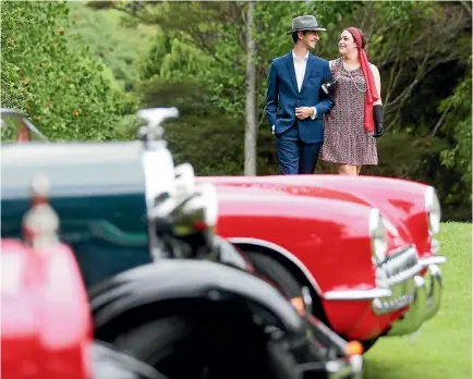  ?? PHOTO: MARK TAYLOR/FAIRFAX NZ ?? Kodi Murray and Maddy Thompson made for a very dapper couple as they strolled amid the vintage cars, provided for the Katherine Mansfield Garden Party by the Waikato Veteran and Vintage Car Club and the Hamilton Classics Museum.