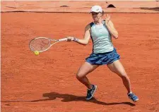  ?? Michel Euler/Associated Press ?? Iga Swiatek plays a shot against Danka Kovinic during Saturday’s match, won by Swiatek in straight sets.