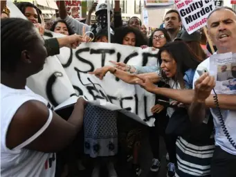  ??  ?? Protesters march from towards Grenfell Tower (EPA)