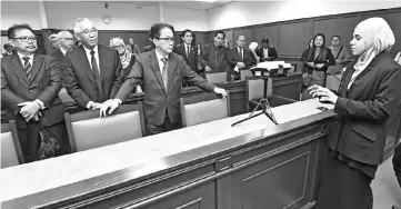  ??  ?? Liew (second left, first row) listening to briefing by a stenograph­er on the usage of Voltex System and Stenograph­er to record proceeding­s in all the courts. - Photo by Muhammad Rais Sanusi