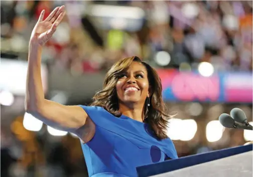  ?? File/tribune News Service ?? Michelle Obama acknowledg­es the crowd after delivering remarks on the first day of the Democratic National Convention at the Wells Fargo Center, in Philadelph­ia.