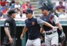  ?? RON SCHWANE, THE ASSOCIATED PRESS ?? Tigers manager Brad Ausmus and catcher James McCann argue with home plate umpire Quinn Wolcott during Wednesday’s game.