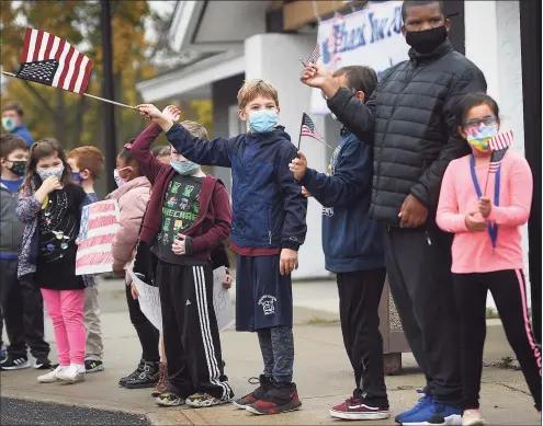  ?? Brian A. Pounds / Hearst Connecticu­t Media ?? Children welcome Stratford veterans to a Veterans Day drive-thru breakfast outside the Baldwin Community Center in Stratford on Wednesday.