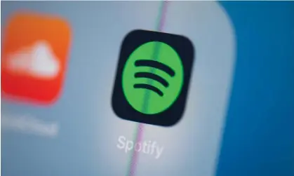  ?? Photograph: Martin Bureau/AFP/Getty Images ?? ‘Spotify said that audiobook rights holders are compensate­d “based on which titles are listened to and how long they are listened to.’