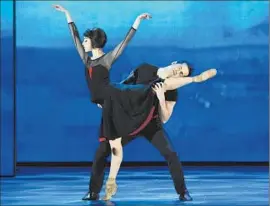  ?? Theo Wargo Getty Images ?? ROBERT FAIRCHILD and Leanne Cope, nominees for their performanc­es in the musical “An American in Paris,” dance a number onstage Sunday.