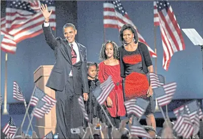  ?? ?? Presidente­lect Barack Obama, with daughers Sasha and Malia, and wife Michelle, at victory rally in Grant Park, Chicago on November 4, 2008