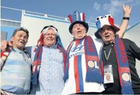  ??  ?? > Olympique Lyonnais supporters in fine spirit before kick-off