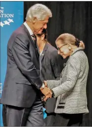  ?? (Democrat-Gazette file photo) ?? Supreme Court Justice Ruth Bader Ginsburg is welcomed by former President Bill Clinton on Sept. 3, 2019, at her appearance at then-Verizon Arena in North Little Rock. Clinton appointed Ginsburg to the Supreme Court in 1993.