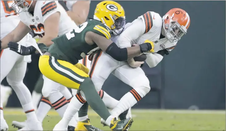  ?? AP PHOTO/AARON GASH ?? Green Bay Packers’ Rashan Gary sacks Cleveland Browns’ Baker Mayfield during the first half of an NFL football game Saturday, Dec. 25, 2021, in Green Bay, Wis.