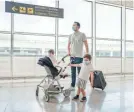  ?? ORBON ALIJA/GETTY IMAGES ?? Passengers are required to wear a mask while flying on a plane for all major U.S. airlines and at the airport.