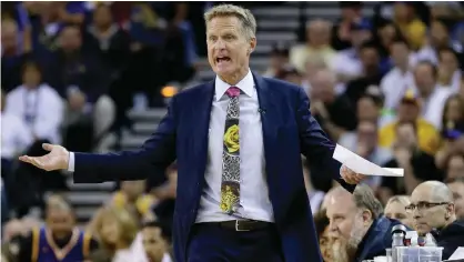  ??  ?? OAKLAND: In this Oct 25, 2016, file photo, Golden State Warriors coach Steve Kerr reacts during the team’s NBA basketball game against the San Antonio Spurs. — AP