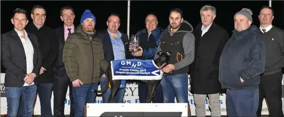  ??  ?? Denis Murphy (GMHD.ie) presents the winner’s trophy to Davy Mahony on behalf of the owners after Toolmaker Daddy won the GMHD.ie Juvenile Classic Final at the Kingdom Stadium on Friday. Included from left are Simon Galvin, Ger Dollard (CEO IGB), Declan Dowling (KGS), trainer Robert Gleeson, Fran Burke, Billy O’Dwyer (IGB), Tim O’Shea and Kieran Casey (KGS).