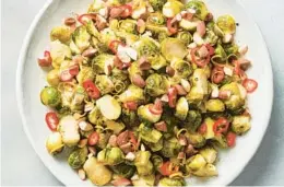  ?? CHRISTOPHE­R TESTANI/FOR THE NEW YORK TIMES ?? Roasting Brussels sprouts helps develop their deep savory notes. To avoid soggy steamed sprouts, heat your sheet pan in the oven.