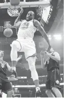  ??  ?? GOLDEN State Warriors’ Andre Iguodala dunks during the first half of their NBA game against the Milwaukee Bucks on Friday in Milwaukee. The Warriors won, 105-95. (AP)