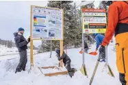  ?? CHRIS DILLMANN/VAIL DAILY ?? The avalanche danger and informatio­n sign is moved by U.S. Forest Snow Rangers Monday to accommodat­e a new beacon checkpoint sign at Vail Pass, Colo.
