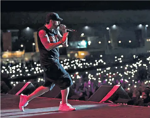  ??  ?? Crowd-pleaser: hints that some of the set was prerecorde­d didn’t spoil the Eminem spectacle