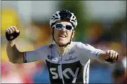  ?? PETER DEJONG — THE ASSOCIATED PRESS ?? Britain’s Geraint Thomas celebrates as he crosses the finish line to win the eleventh stage of the Tour de France cycling race over 108.5 kilometers (67.4 miles) with start in Albertvill­e and finish in La Rosiere Espace San Bernardo, France.