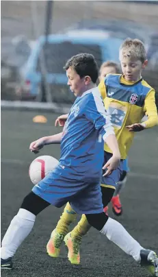  ??  ?? Russell Foster League U10 action at East Durham College, Peterlee, with Durham City Juniors (yellow) and South Tyneside Spitfires (blue),