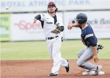  ??  ?? HarbourCat­s infielder Tanner Haney unloads to first for a double play as AppleSox base runner Jacob Prater comes charging in during West Coast League action at Wilson’s Group Stadium at Royal Athletic Park on Friday.