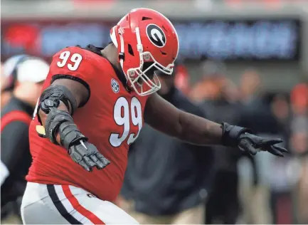  ?? JOSHUA L. JONES/ATHENS BANNER-HERALD - USA TODAY NETWORK ?? Georgia defensive lineman Jordan Davis dances on the sideline during the first half against Missouri Nov. 6 in Athens, Ga. Georgia won 43-6.