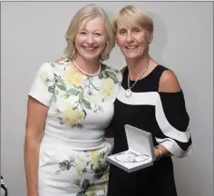  ??  ?? Adalene Delahunt, a prize winner in the Lady Captain’s Prize competitio­n at Blainroe Golf Club, receives her prize from Lady Captain Tina Meehan.