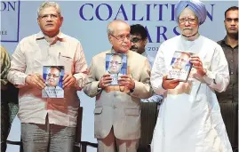  ?? PHOTO: PTI ?? Former president Pranab Mukherjee ( centre) with former prime minister Manmohan Singh ( right) and CPI (M) leader Sitaram Yechury at the release of Mukherjee’s book, The Coalition Years 1996-2012, in New Delhi on Friday